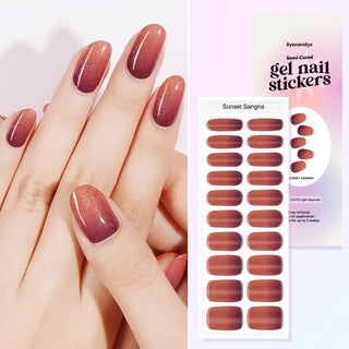 Hands with EyeCandys Sunset Sangria Gel Nail Stickers, featuring a beautiful brown and red ombre design. Perfect for a stunning, gradient manicure. Ideal for gel nail enthusiasts, easy-to-apply ombre nail stickers for a long-lasting, professional nail look