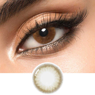 A hazel circle contact lens on top of a brown eye with smoky eye makeup and long eyelashes, above the design of the contact lens itself.