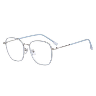The Therese Oversized Square by EyeCandys features silver metal geometric frames with clear nose pads, slender arms with light blue tips, and a sleek TR and metal build, all elegantly displayed on a white background.