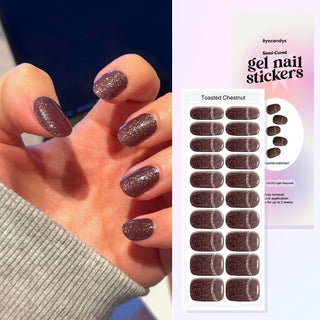 Hand featuring EyeCandys toasted chestnut gel nail stickers, with a film displaying the design. Ideal for effortless, trendy nail art with durable, vibrant patterns and a professional finish for at-home manicures