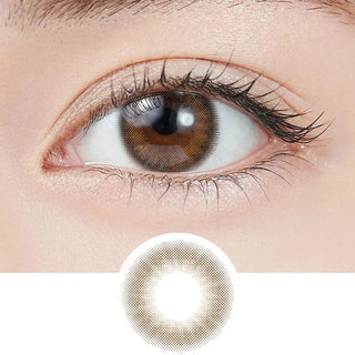 Close-up shot of model's eye adorned with Topards 1-Day Garnet Brown (10pk) daily color contact lenses with prescription, paired with clean-girl eye makeup, showing the brightening and enlarging effect of the circle contact lens on dark brown eyes, above a cutout of the contact lens with limbal ring on a white background.