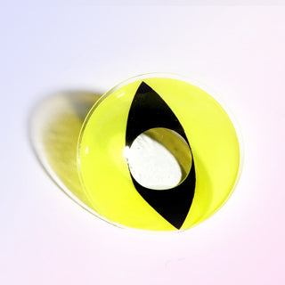 Macro shot of the EyeCandys cat eye cosplay prescription colored contact lens on a white background, highlighting the intricate details and pattern of the lens design.