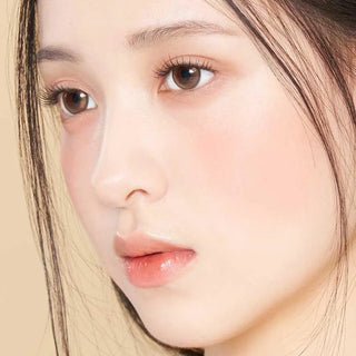Asian model demonstrating a K-idol-inspired look with Amber Brown daily coloured contact lenses, highlighting the instant brightening and enlarging effect of the circle contact lenses over dark irises.