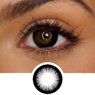 Close up shot of a model with natural brown eyes wearing EyeCandys GEO Extra Magic Black colored contact lens complemented by natural eye make up next to a cutout of the lens design