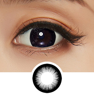 Close up shot of a model with natural dark eyes wearing EyeCandys GEO Extra Magic Black colored contact lens complemented by natural eye make up next to a cutout of the lens design