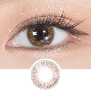 Close-up of an eye with long lashes wearing EyeCandys Attitude Glitter Choco prescription colored contact lens, showing the lens design below.