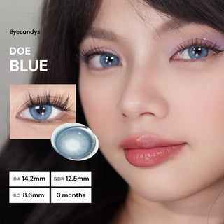 Model wearing EyeCandys Doe Blue colored prescription contact lenses — ocean-inspired blue lenses with soft limbal ring and natural iris pattern. Bright, vivid, and comfortable 3-tone circle lenses perfect for dark eyes.