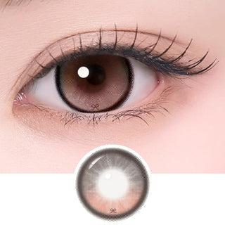 Close-up of eye with long lashes wearing Eyecandys i-Sha Reborn Rosywood contact lens, showcasing detailed lens design and natural rosywood color enhancement.