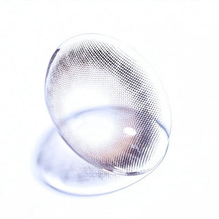 Macro shot of EyeCandys Olola Meow Koshort Grey colored contact lens, showcasing intricate lens pattern and subtle grey color.