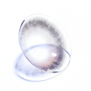 Macro shot of EyeCandys Olola Meow Koshort Grey colored contact lens, showcasing intricate lens pattern and subtle grey color.