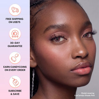 A woman with glowing skin and pink makeup looks ahead, wearing EyeCandys Shade Pink natural-looking contacts. Icons left show free shipping over $75, 30-day guarantee, CandyCoins rewards, and subscribe & save.