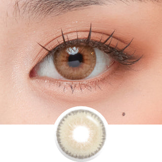 Close-up shot of model's eye adorned with Toffee Brown prescription colour contact lenses, complemented by clean eye makeup, showing the brightening effect of the prescription cosmetic contact lens on dark brown eyes.
