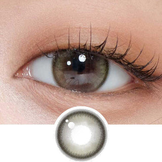 Close-up shot of model's eye adorned with Gemhour Demeter 1-Day Olive Green (10pk) daily color contact lenses with prescription, complemented by clean eye makeup, showing the brightening and enlarging effect of the circle contact lens on dark brown eyes, above a cutout of the contact lens pattern with limbal ring on a white background.