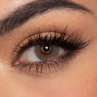 Close-up of model's eye wearing EyeCandys Glossy Ivory Prescription Colored Contact Lens, showcasing vibrant and natural eye enhancement