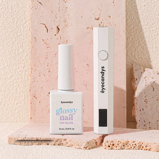 EyeCandys Glossy Nail Top Glaze and UV Lamp for a professional, long-lasting manicure. Achieve a high-shine finish and perfect curing with these essential tools for gel nails.