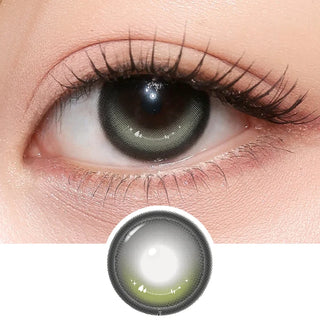 Close-up of eye with long lashes wearing i-Girl One Pick Dear One Grey contact lenses from EyeCandys, showcasing natural grey color and detailed lens design pattern underneath