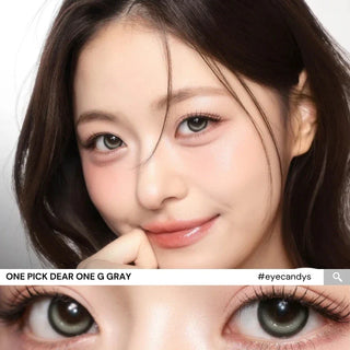 Close-up of model’s eyes wearing i-Girl One Pick Dear One Grey contact lenses from EyeCandys, showing smoky grey color, double-circle iris design, subtle eye-widening effect, and realistic dimensional highlights
