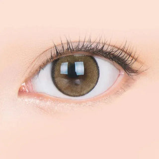 Macro shot of an eye wearing the i-Sha Jadey Stone Brown prescription colour contact lens, showing the multi-colored detail and natural effect on dark brown eyes.