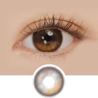 Macro shot of an eye wearing the i-Sha Oriana Edge Plus 1-Day Shade Brown (10pk) prescription colour contact lens, showing the multi-colored detail and natural effect on dark brown eyes, with clean eye makeup. At the bottom is the pattern of the colored lens design, showing the dotted detail and pigmentation.