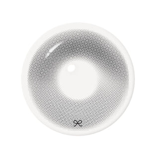 Close-up product image of gray contact lens featuring an intricate dotted pattern, soft gradient, hading, a clear central pupil opening, and a subtle brand logo.