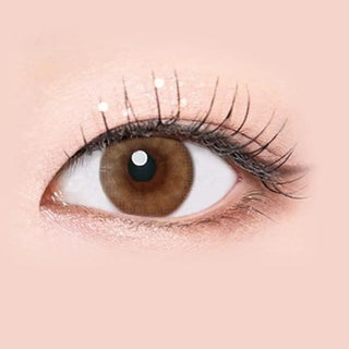 Macro shot of an eye wearing the i-Sha Serenity 1-Day Brown (10pk) prescription colour contact lens, showing the multi-colored detail and natural effect on dark brown eyes.