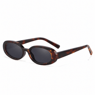 EyeCandys Jellicle Tortoiseshell oval sunglasses product shot on a white background featuring a lightweight full-frame design. Trendy unisex 90s-inspired fashion sunglasses with a minimalist oval silhouette, flattering for diamond and heart face shapes. Stylish everyday UV protection eyewear in a classic tortoiseshell frame.