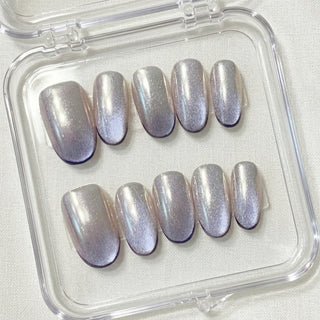 Short oval press on nails EyeCandys Lavendroid with holographic chrome base, cat eye shimmer, and deep violet gradient tips.
