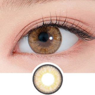 Close-up shot of a model's eye wearing Lensrang Iwwitch Up Brown color contacts with prescription, paired with K-beauty-inspired eye makeup, showing the brightening and enlarging effect of the circle contact lens on dark brown eyes, above a cutout of the contact lens pattern with limbal ring on a white background.