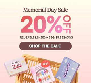 Memorial Day Sale homepage banner featuring 20% off reusable contact lenses and Buy 3 Get 1 free press-on nails from EyeCandys, with pastel product boxes and shopping basket on a soft pink background.