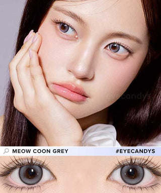 A female model with natural dark eyes wearing Olala Meow Coon Grey  contact lenses, complemented by subtle eyeshadow and peach lip gloss and Close-up image showcases the model's eyes adorned with the same Grey contact lenses
