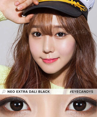 A young woman with long brown hair and light makeup wears a captain's hat, modeling NEO Vision Extra Dali Black lenses. A close-up shows the bold effect of these circle contacts. The text reads "#EYECANDYS".