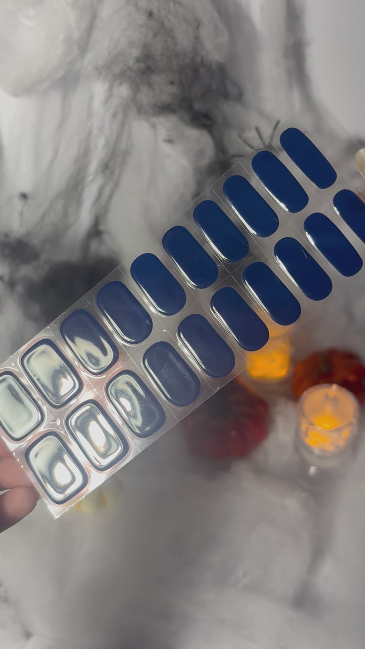 Hand wearing EyeCandys Midnight Magic Gel Nail Sticker – rich ink-blue nails with a polished, sophisticated finish. Timeless DIY gel manicure perfect for everyday elegance or evening chic looks. Non-toxic, vegan, and long-lasting salon-quality gel nails.