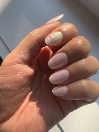 Model's hand showcasing EyeCandys Gel Nail Stickers. These stickers feature a sweet, soft design with a glossy finish, providing a chic, long-lasting manicure that adds a touch of elegance and fun to your nails