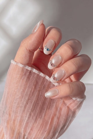 Bubbly press-on nails worn on hand