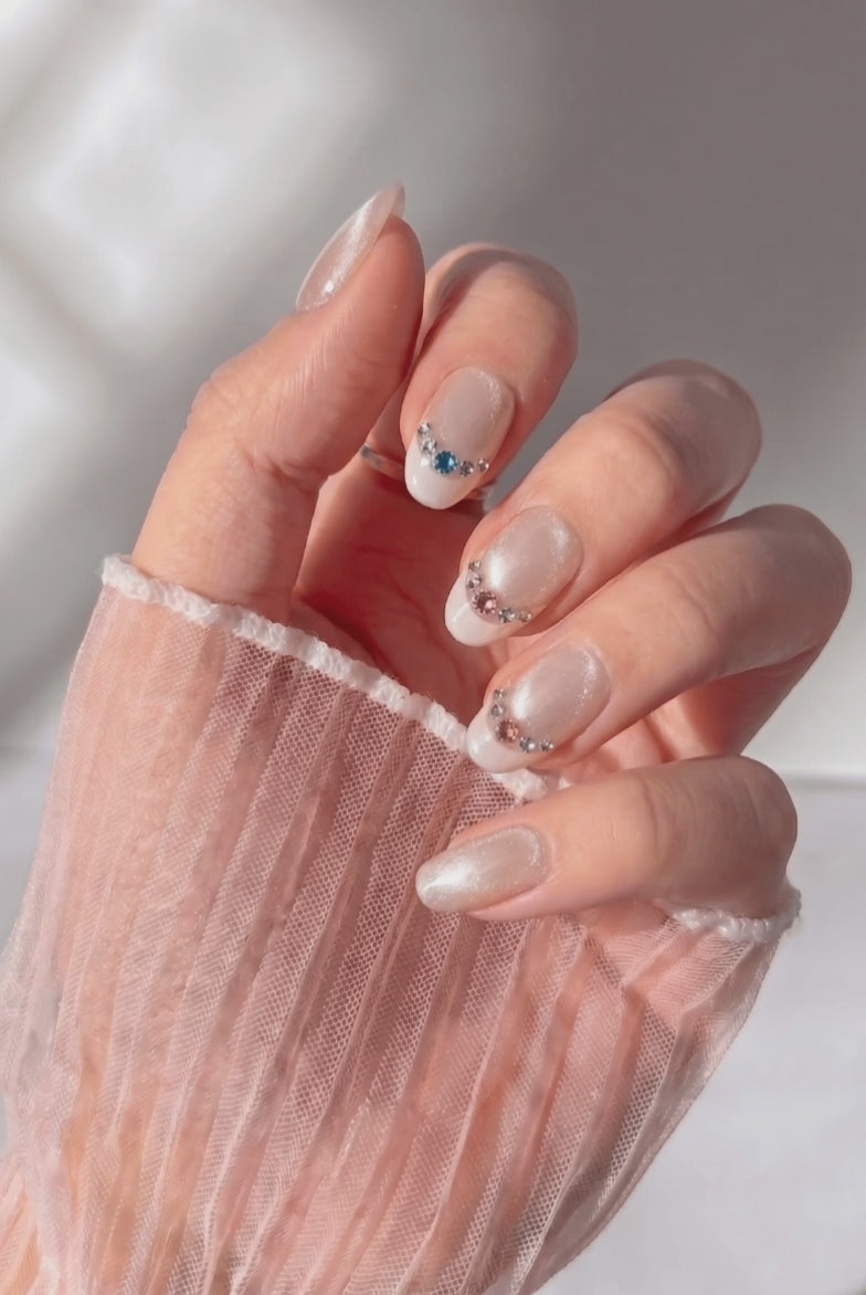 Bubbly press-on nails worn on hand