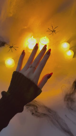 Application of EyeCandys Wine Not Gel Nail Stickers for Halloween, featuring dark and spooky designs for DIY festive nail art.