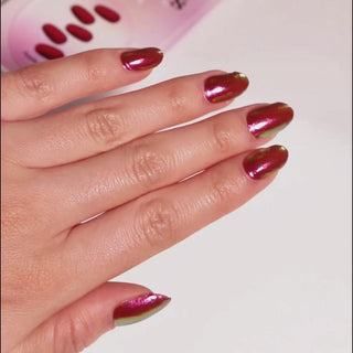 Model's hand showcasing EyeCandys Apple Pie Gel Nail Stickers. These stickers feature a warm, inviting design with a glossy finish, offering a chic, long-lasting manicure perfect for adding a touch of elegance and sweetness to your nails