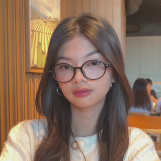 Female wearing EyeCandys Chase Round Oval prescription reading glasses with blue light blocking lenses. Lightweight full-frame TR glasses in a classic round-oval design, available in Black, Mauve, and Tortoiseshell, offering a comfortable narrow fit for diamond and heart-shaped faces.