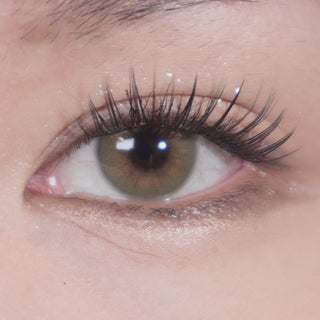 Close-up video of eye with long lashes wearing Eyecandys Cashmere Hazel prescription colored contact lens, showcasing natural hazel tone, lens detail, and comfortable fit.