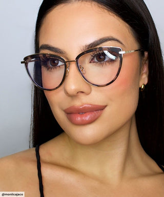 Woman wearing Eyecandys Shelly Cat-Eye Glasses with a chic metal-accented frame, showcasing stylish eyewear for a modern, sophisticated look.