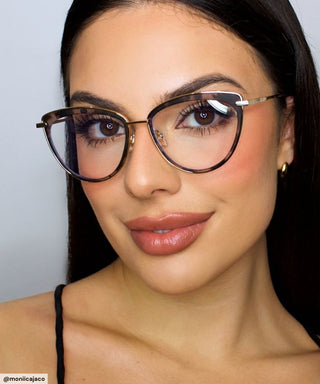 Woman wearing Eyecandys Shelly Cat-Eye Glasses with a chic metal-accented frame, showcasing stylish eyewear for a modern, sophisticated look.