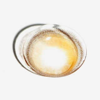 Macro shot of EyeCandys hazel colored contact lens. High-quality lenses designed to enhance natural eye color with vibrant, realistic hues for a stunning, eye-catching look and all-day comfort