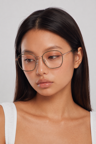 EyeCandys Therese Oversized Square Matte Green glasses model shot featuring oversized matte green square frames with non-prescription clear lenses, trendy women's fashion eyewear, blue light style glasses for everyday wear, office outfits, minimalist fashion, and modern luxury looks.