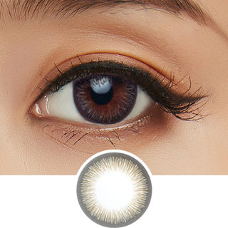 Close-up shot of model's eye adorned with Acuvue 1-Day Define Radiant Charm color contact lens dailies, complemented by clean eye makeup, showing the brightening effect of the circle lenses on dark brown eyes, above a cutout of the colour contact lens design with radial spiked pattern