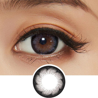 Design of the Pink Label Blossom Grey Colored Contacts Circle Lenses from Eyecandys on a white background, showing the pixel detail. While a separate illustration, above, a detailed photograph focuses on the eyes of a model, showcasing the Pink Label Blossom Grey contact lens prominently. This is accompanied by natural glowing eyeshadow and mascara. 