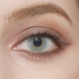 Close-up of Pink Label Dewy Aqua blue colored contact lens
