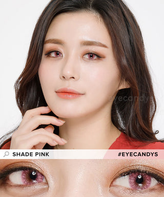Model wearing pink contact lenses above a cut-out of close-up of dark eyes wearing the same bubblegum-pink contacts