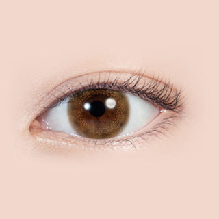 Close-up shot of model's eye adorned with Lilmoon 1-Day Rusty Beige (10pk) color contact lenses with prescription, complemented by minimalist eye makeup, showing the brightening and enlarging effect of the circle contact lens on dark brown eyes.