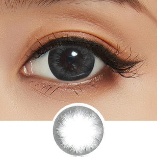 EyeCandys Pink Label Silicone Hydrogel Lupin Grey Colored Contacts Circle Lenses on a dark brown eye with minimal eye makeup. With the design of the Lupin Grey circle contact lens