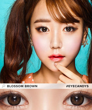 Asian model showcases Pink Label Blossom Brown lenses, with her hand posing below her lips, highlighting the captivating effect of the brown contacts in a close-up image. While a separate illustration detailed photograph focuses on the eyes of a model, showcasing the Pink Label Blossom Brown contact lens prominently. This is accompanied by natural glowing eyeshadow.